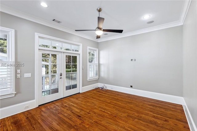 unfurnished room featuring french doors, a healthy amount of sunlight, and hardwood / wood-style flooring