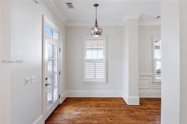 interior space featuring crown molding and wood-type flooring