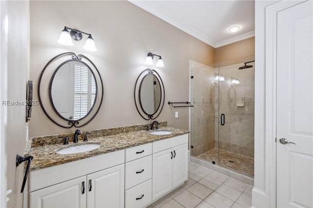 bathroom featuring crown molding, vanity, a shower with shower door, and tile patterned flooring