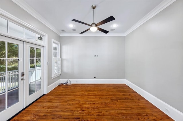 unfurnished room featuring ornamental molding, wood-type flooring, ceiling fan, and french doors