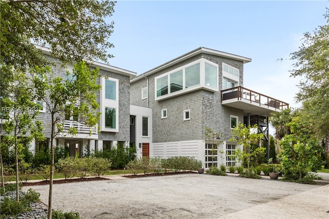 back of property with a balcony