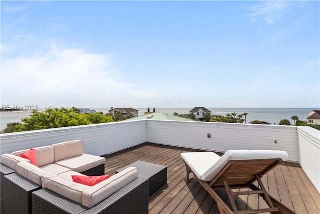 wooden deck featuring an outdoor hangout area and a water view