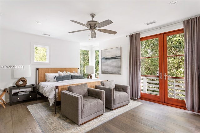 bedroom with hardwood / wood-style flooring, french doors, and ceiling fan