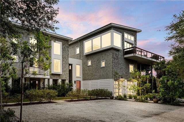 view of front of property with a balcony