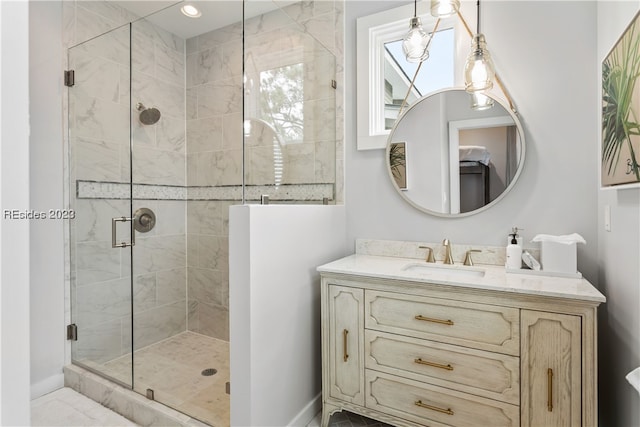 bathroom featuring vanity and an enclosed shower