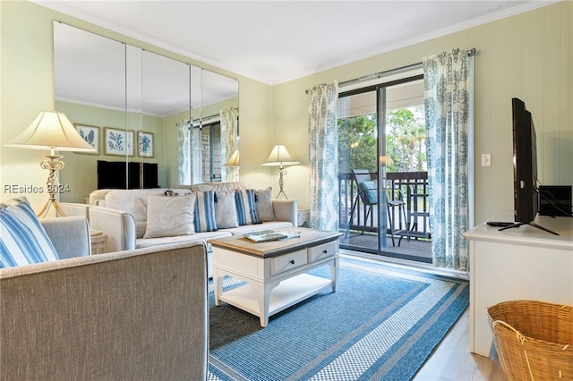 living room with ornamental molding and hardwood / wood-style floors