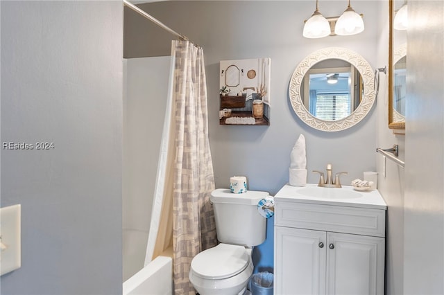 full bathroom with vanity, shower / bath combination with curtain, and toilet