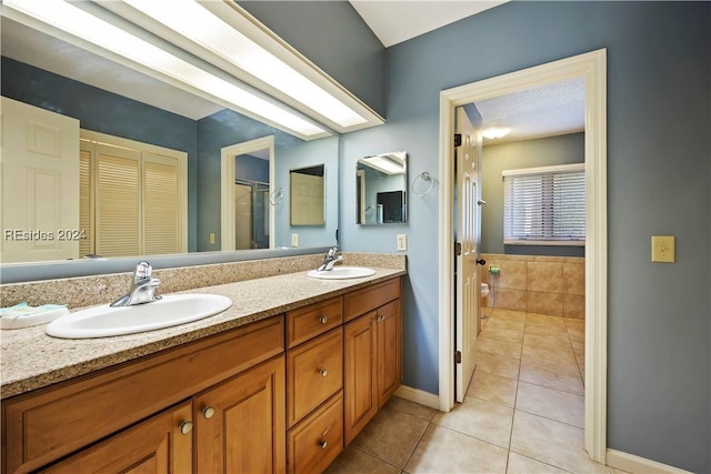 bathroom featuring tile patterned flooring and vanity