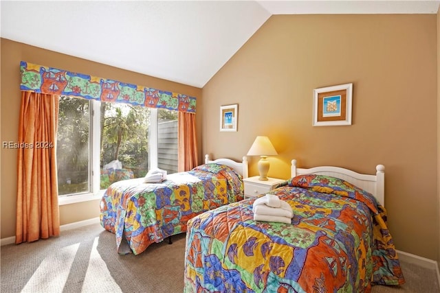 bedroom featuring multiple windows, vaulted ceiling, and carpet flooring