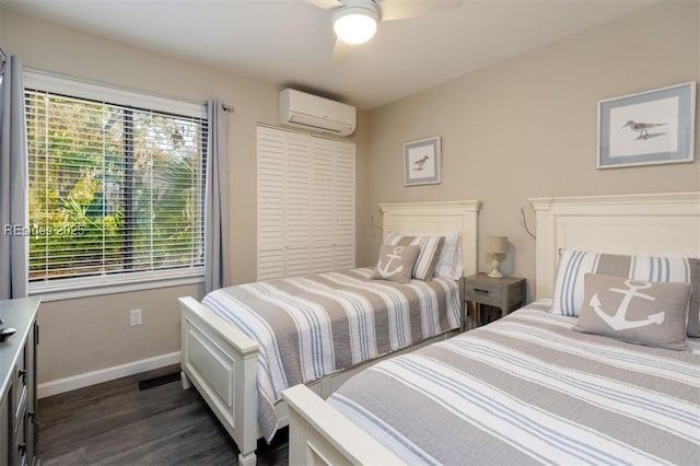 bedroom featuring dark wood-type flooring, a wall unit AC, a closet, and ceiling fan