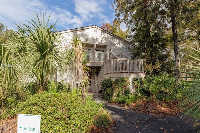 rear view of house with a wooden deck