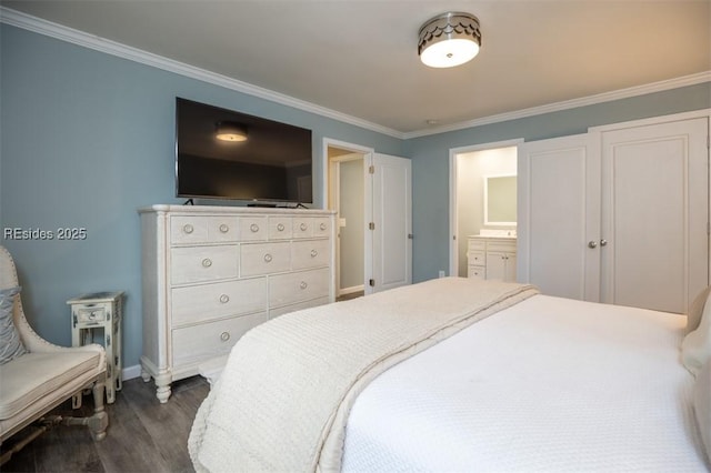 bedroom featuring crown molding, dark wood-type flooring, and ensuite bath