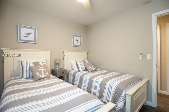 bedroom featuring dark hardwood / wood-style flooring and ceiling fan