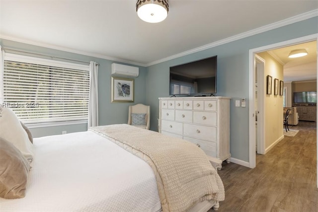 bedroom featuring ornamental molding, wood-type flooring, and a wall unit AC