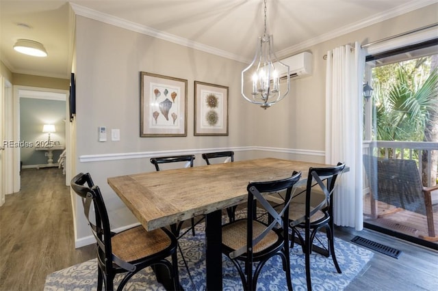 dining area with hardwood / wood-style flooring, crown molding, a wall mounted AC, and a notable chandelier