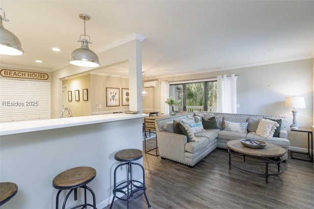 living room featuring ornamental molding, dark hardwood / wood-style flooring, and a wall unit AC