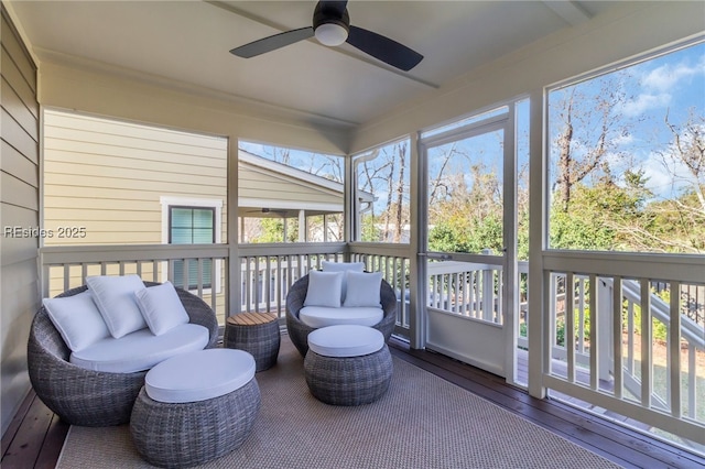 sunroom with ceiling fan