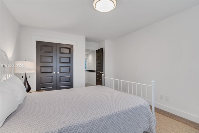 carpeted bedroom featuring a closet