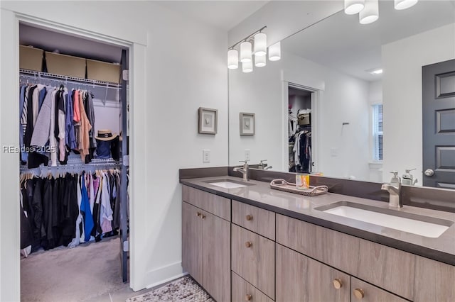 bathroom with tile patterned floors and vanity