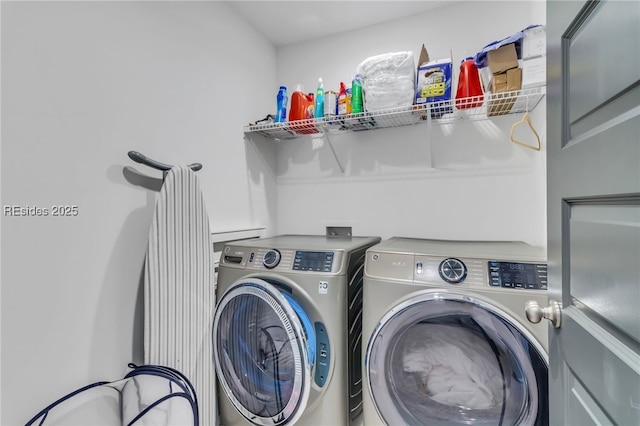 washroom with washing machine and clothes dryer