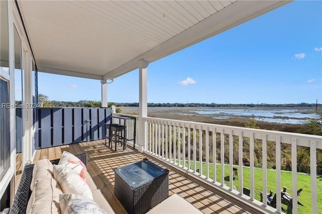 balcony featuring a water view