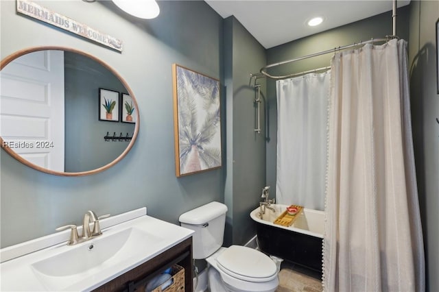 full bathroom with vanity, toilet, and shower / tub combo