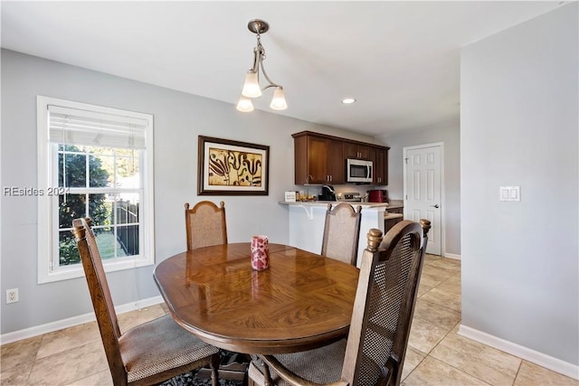 dining space with light tile patterned floors