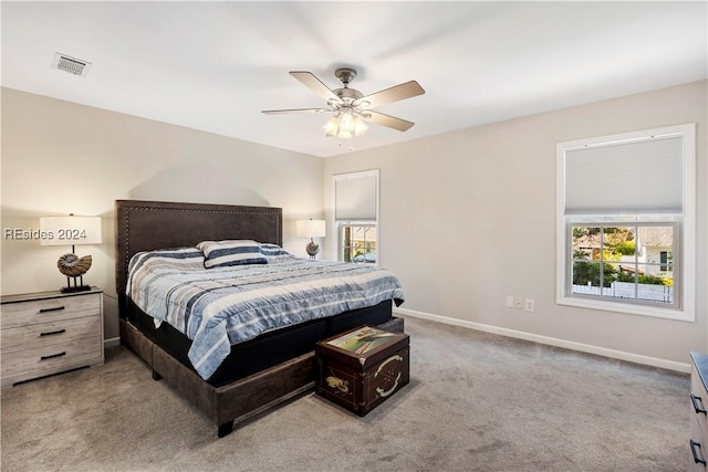 bedroom with multiple windows, carpet floors, and ceiling fan