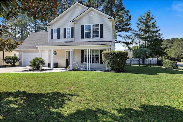 front of property featuring a porch, a garage, and a front lawn