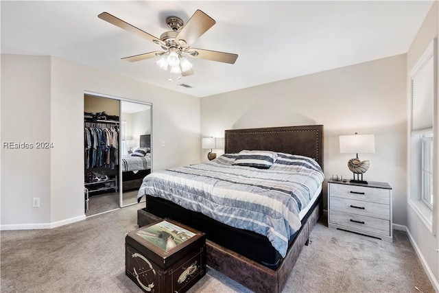 carpeted bedroom featuring ceiling fan and a closet