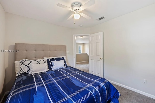 unfurnished bedroom featuring carpet floors and ceiling fan