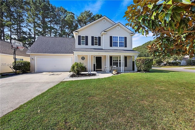 front of property featuring a garage, a front yard, and covered porch