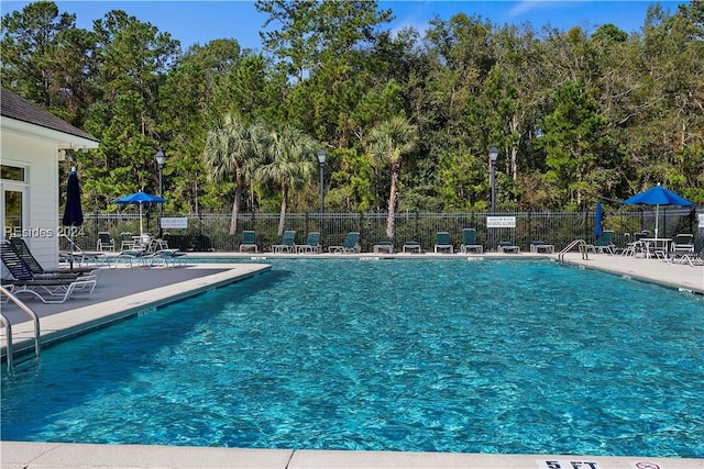 view of swimming pool featuring a patio area