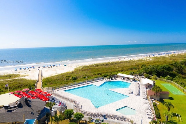 drone / aerial view with a view of the beach and a water view