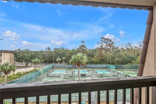 view of pool featuring tennis court