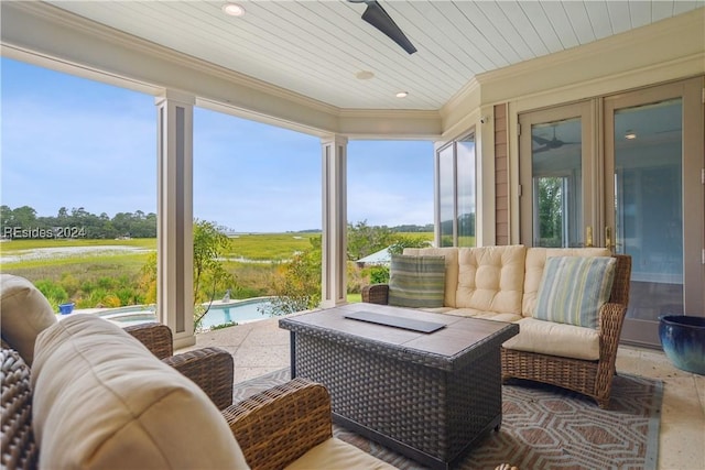 sunroom with wood ceiling and ceiling fan