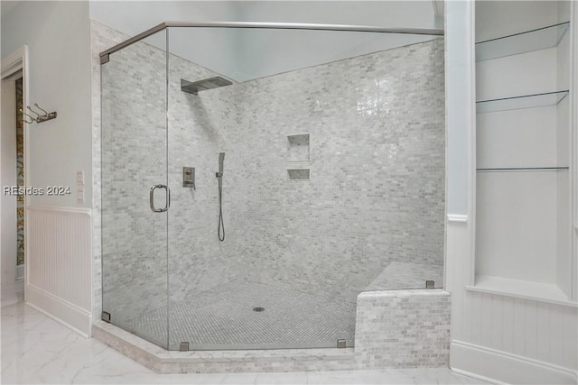 bathroom with a shower with shower door