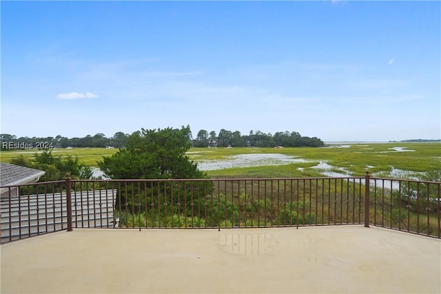 view of patio with a water view