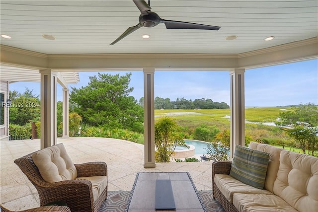 sunroom with a wealth of natural light, wooden ceiling, and ceiling fan