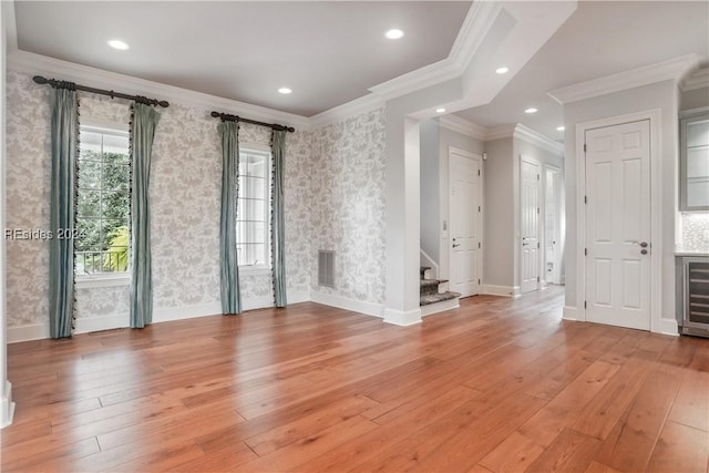 interior space featuring light hardwood / wood-style flooring and ornamental molding