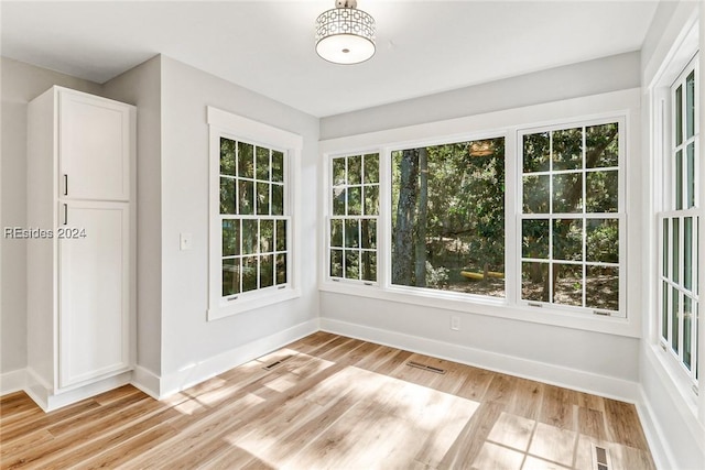 unfurnished sunroom featuring plenty of natural light