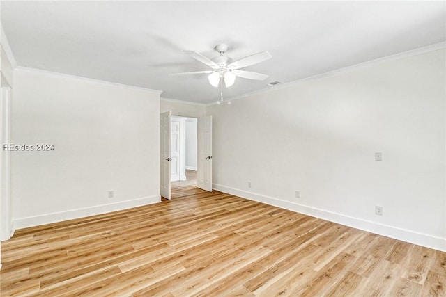 empty room with ornamental molding, ceiling fan, and light wood-type flooring