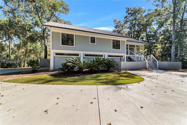 view of front of house with a garage and a porch