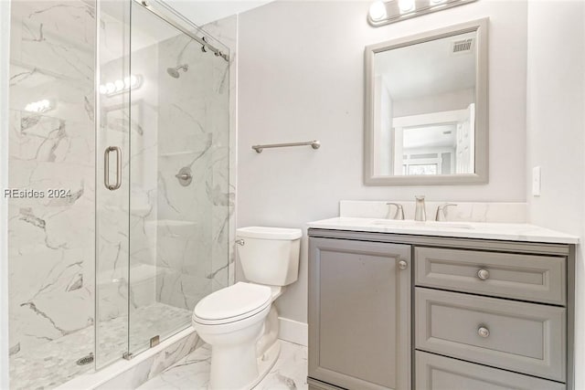 bathroom with vanity, an enclosed shower, and toilet