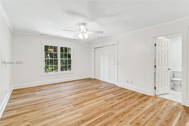 unfurnished bedroom with connected bathroom, crown molding, ceiling fan, and light wood-type flooring