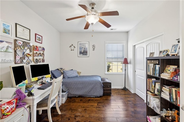 bedroom featuring ceiling fan and dark hardwood / wood-style floors