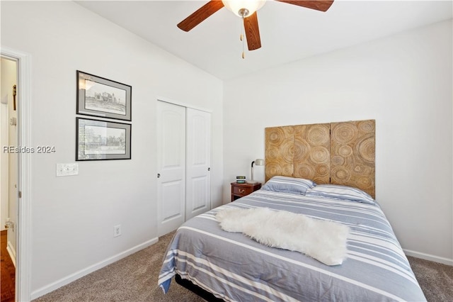 carpeted bedroom with ceiling fan and a closet