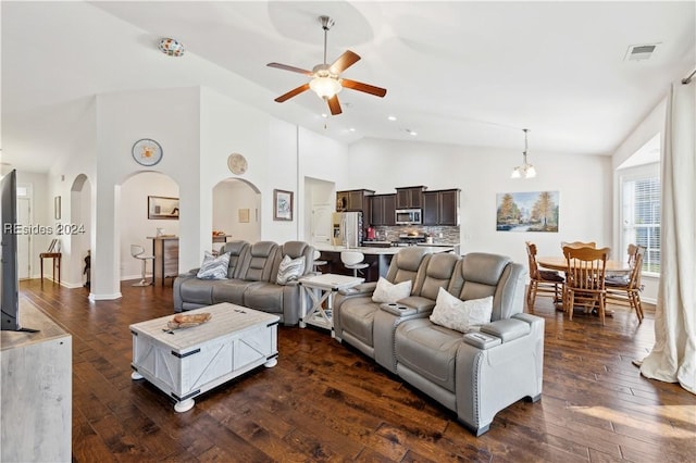 living room with ceiling fan, dark hardwood / wood-style flooring, and high vaulted ceiling