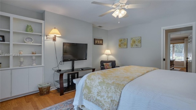 bedroom with ceiling fan and light wood-type flooring