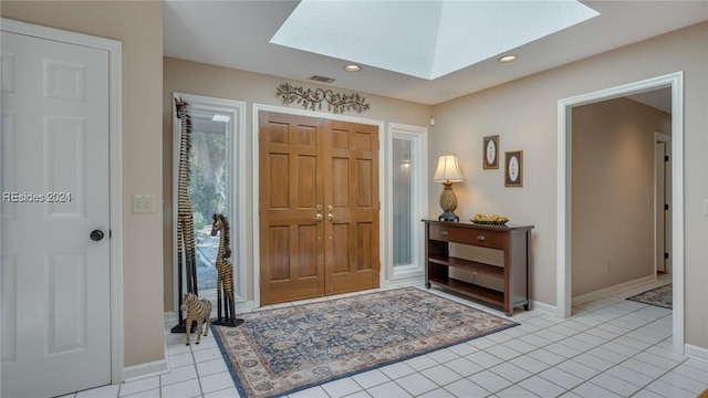 tiled entryway with a skylight